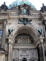 Detail of entrance to Berliner Dom, with painting of Christ on wall under an arch
