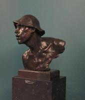 Bronze bust of man in floppy hat