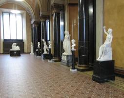 Hallway with white sculptures along the wall