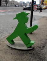 Small statue of a green “walk” icon