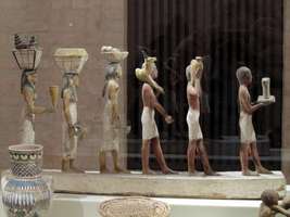Sculpture of six Egyptian workers in a line