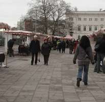 Street market; long view of people and tents