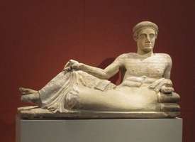 Reclining man on cinerary urn (460-440 BCE)