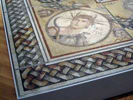 Floor mosaic with geometric pattern on edge and portrait of man within