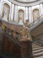 Spiral staircase in Bode museum; statues in niches