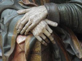 Detail of hands on a carving