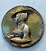 Gold coin showing woman's head in profile