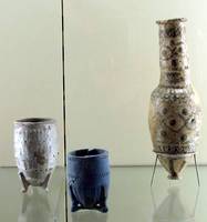 Two jars and a vase; blue jar in center