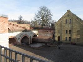 View of fortress brick buildings from second floor interior railing