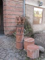 modern brown ceramic fountain near art exhibition at fortress