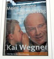 Poster of child whispering in politician's ear. Text: “My voice in the Bundestag/Kai Wegner/In the Bundestag for you.”
