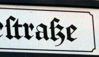 Part of street sign with word “straße” using old-style letter “s”