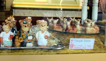 Cartoon-like marzipan deer and bears in bakery window