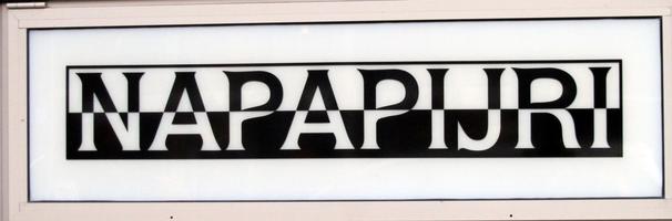 Sign for Napapijri clothing store; top half is black on white; bottom half is white on black