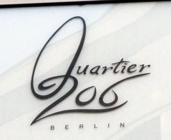 Sign for Quartier 206 department store; the tail of the Q becomes the digit 2