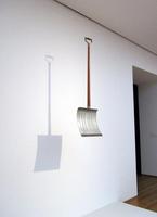 Snow shovel hanging from ceiling