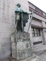 Bronze statue of knight with sword and shield