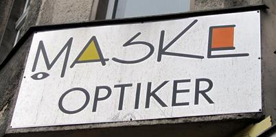 Sign for Maske Optical; the “A” and “E” are in the style of Mondrian