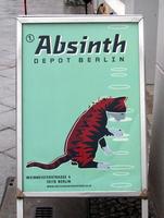 Poster for Absinth Depot Berlin; shows cat standing on hind legs drinking from a glass.