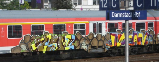 somewhat artistic graffiti on train car