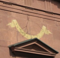 sundial on church wall