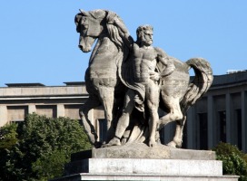 scultpure of horse and bearded man standing at its side