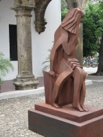 statue of man and woman in embrace