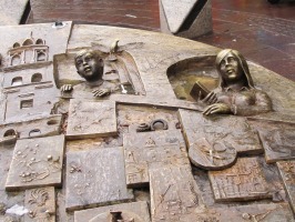 closeup of sculpture showing heads of children