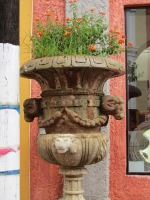 stone urn holding flowers