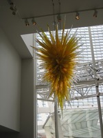 spiky yellow glass sculpture hanging from ceiling