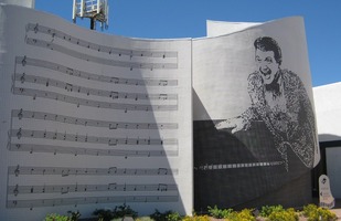 sheet music and pixellated picture of Liberace