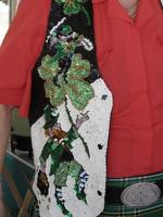 Vest with sequins depicting leprechauns and four-leaf clover
