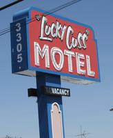 Sign for Lucky Cuss motel