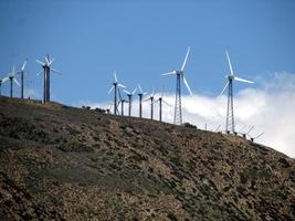 Part of a large “windmill farm” at Tehachapi Pass, CA. Windmills have three large blades.