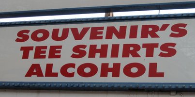 Sign reading: Souvenir's/Tee Shirts/Alcohol