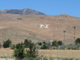 Hillside with large letter N painted on it in white