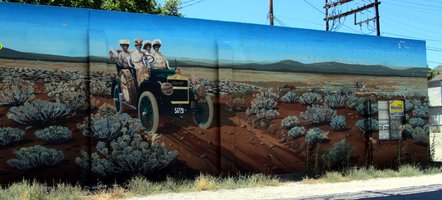 Mural showing women in car in desert landscape