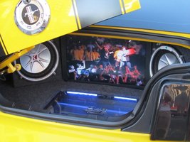 Interior of car trunk showing LCD player