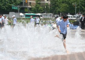 All the adults watching the kids run through the fountain had the same nostalgic expression on their faces.