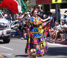 Woman in colorful mexican long dress
