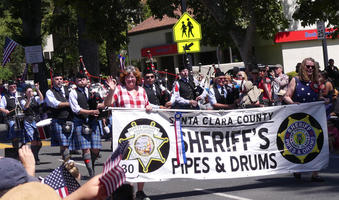 Bagpipers and drummers in kilts