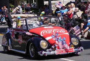 Volkswagen with coca-cola advert on hood and “Bitch Boulevard” license plate