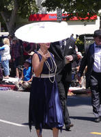 Woman in 20s flapper outfit, carrying parasol