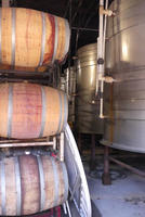 Inside distillery; barrels on left and stainless steel tanks on right