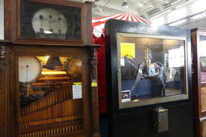 Mechanical music box on left; horse and rider on right