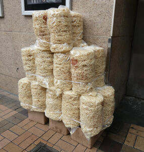 Large bags of noodles outside of restaurant