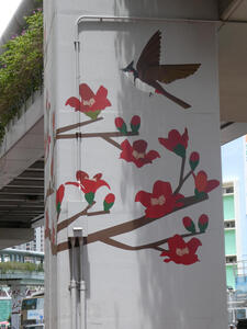 Support column painted with bird and flowering branches