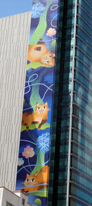 cats painted on side of building