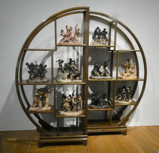 circular cabinet of chinese sculptures