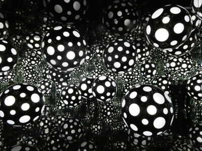 Black balloons with white polka dots, reflected in mirrors
